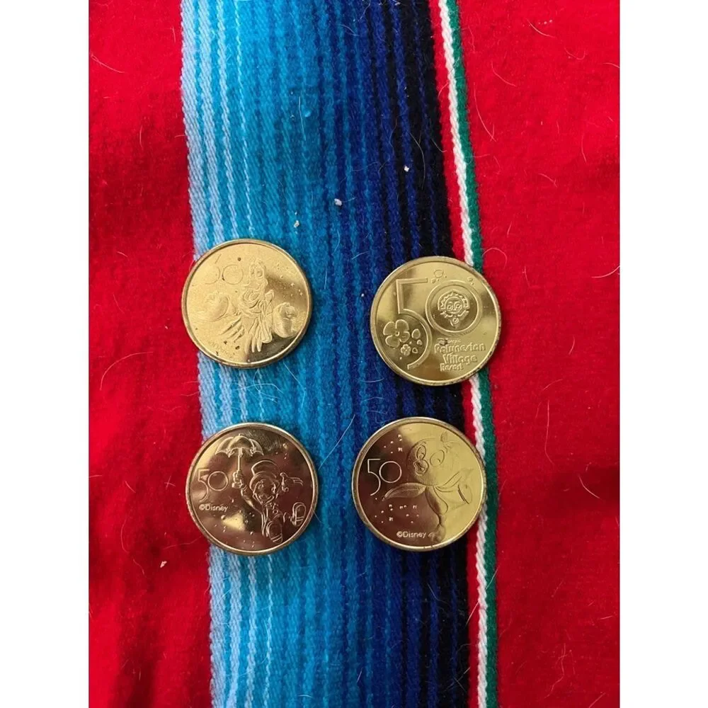 Disney Gold-Tone Collectible Coins on Red and Blue Stripe Fabric